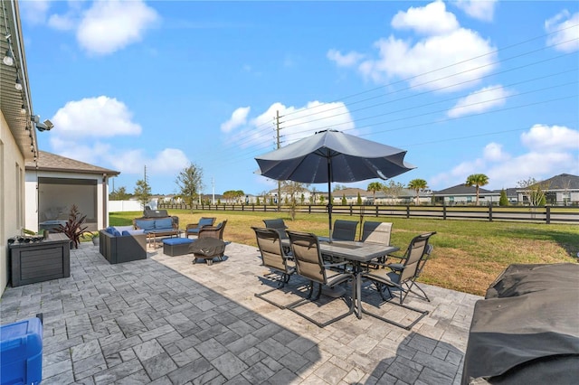 view of patio with outdoor dining space, outdoor lounge area, and a fenced backyard