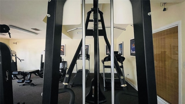 gym featuring baseboards and visible vents