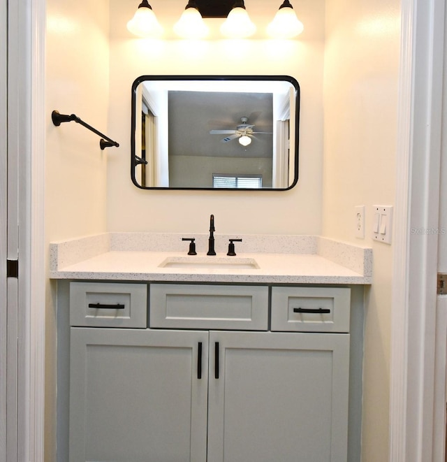 bathroom with ceiling fan and vanity