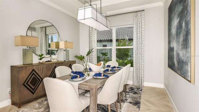 dining area with crown molding and baseboards