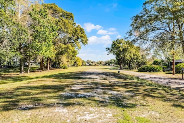 surrounding community featuring a lawn