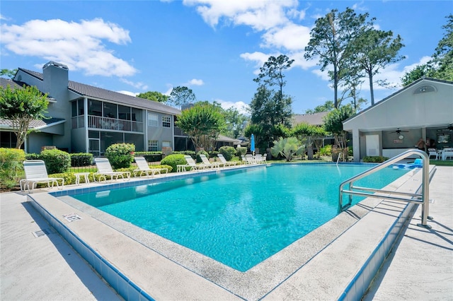 community pool with a patio area