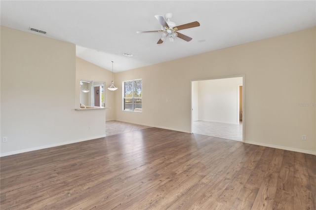 unfurnished living room with vaulted ceiling, visible vents, ceiling fan, and wood-type flooring