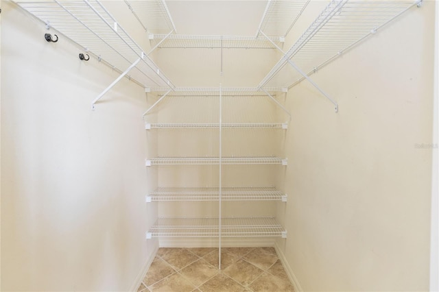 walk in closet featuring tile patterned floors