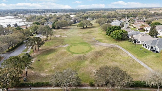 bird's eye view featuring view of golf course and a residential view