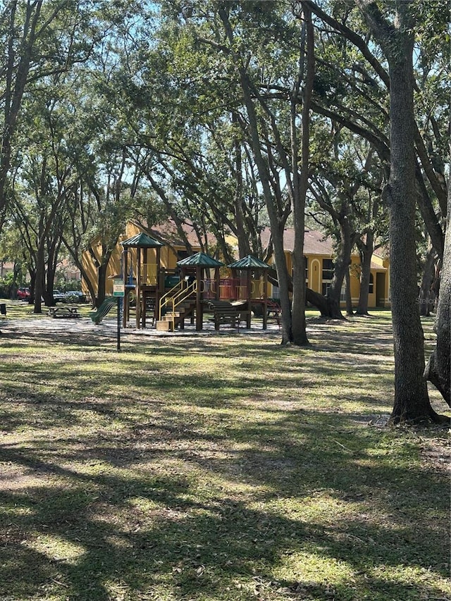 community play area featuring a lawn