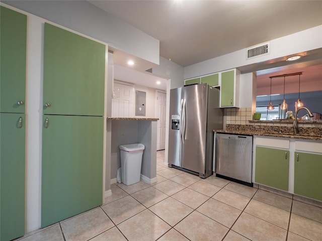 kitchen with visible vents, electric panel, light tile patterned flooring, a sink, and appliances with stainless steel finishes