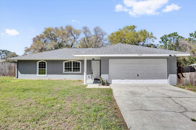 ranch-style house with stucco siding, driveway, a front lawn, and fence