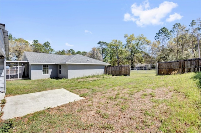 view of yard featuring a patio and fence