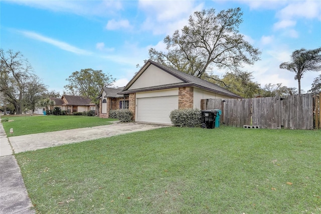 view of front facade featuring fence, driveway, an attached garage, a front lawn, and brick siding