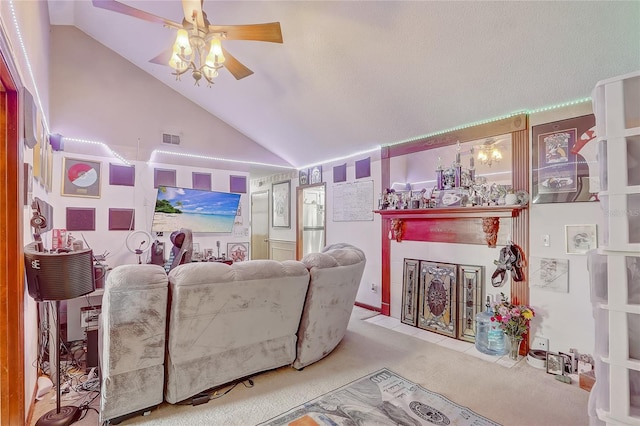 carpeted living room with visible vents, a fireplace with flush hearth, high vaulted ceiling, and ceiling fan