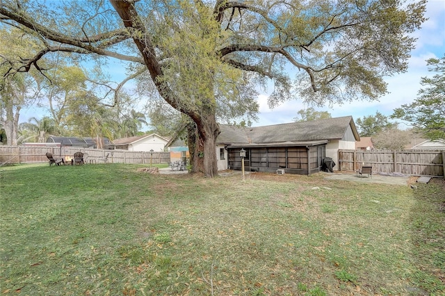 view of yard with a fenced backyard