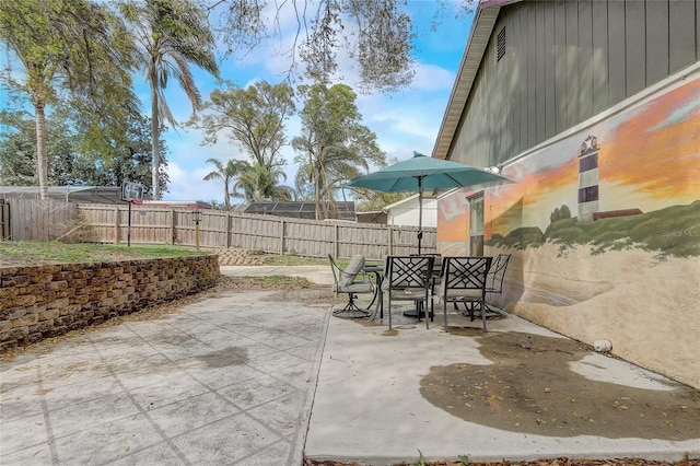 view of patio featuring fence