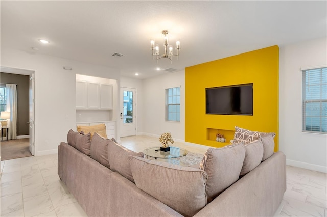 living room with visible vents, baseboards, and marble finish floor