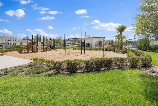 communal playground with a lawn