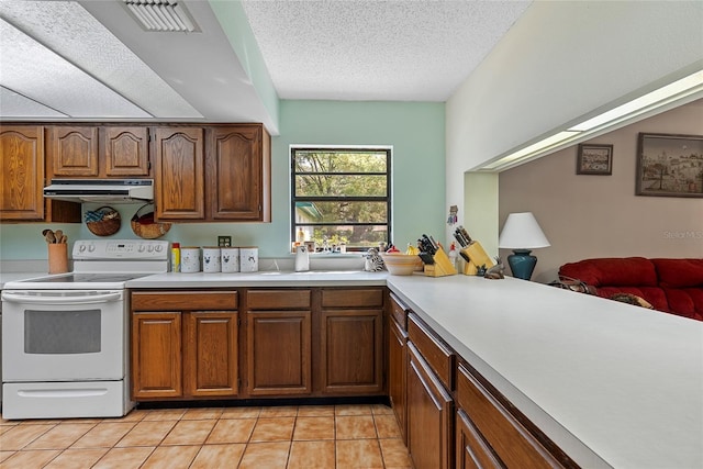 kitchen featuring visible vents, under cabinet range hood, light tile patterned floors, white electric range oven, and a sink