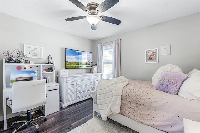 bedroom with dark wood-type flooring and a ceiling fan