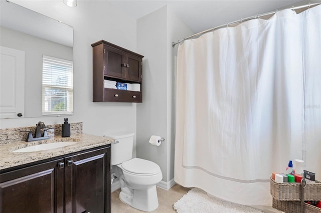 bathroom with baseboards, toilet, a shower with curtain, tile patterned floors, and vanity