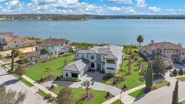 bird's eye view featuring a residential view and a water view