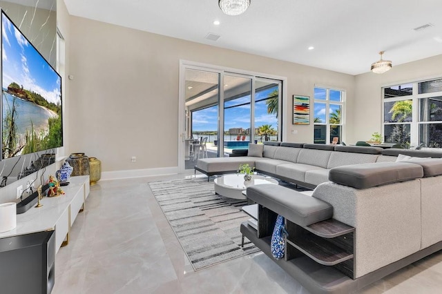 living area with visible vents, recessed lighting, and baseboards