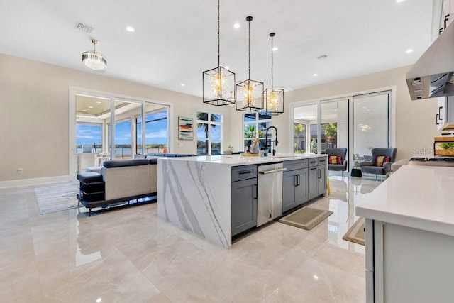 kitchen featuring a sink, gray cabinetry, extractor fan, stainless steel dishwasher, and open floor plan