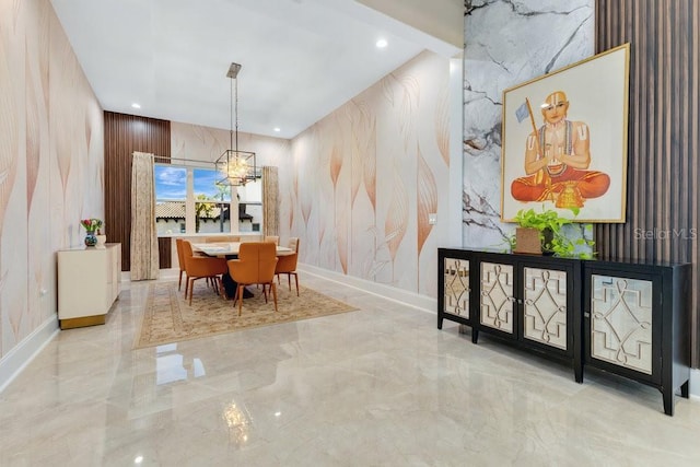 dining space with recessed lighting, baseboards, marble finish floor, and an inviting chandelier