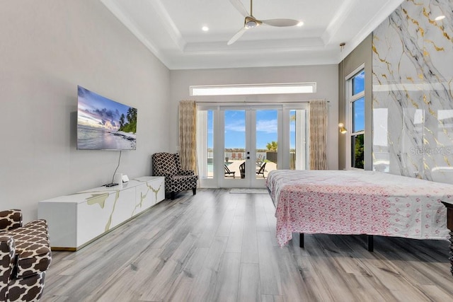 bedroom with french doors, wood finished floors, crown molding, and access to outside