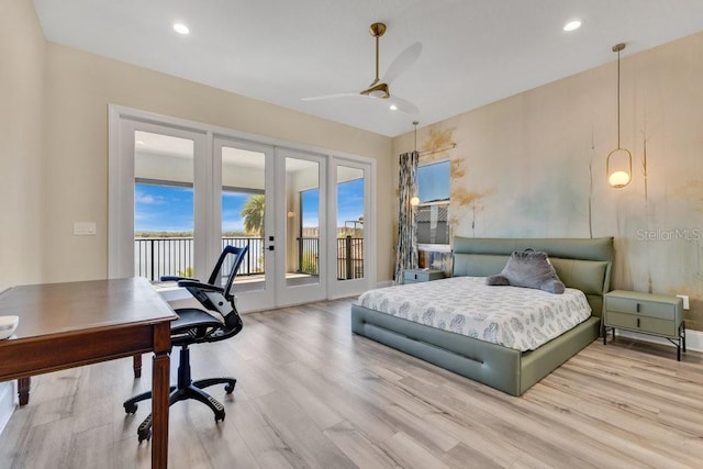 bedroom with recessed lighting, french doors, wood finished floors, and access to outside