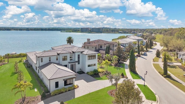 birds eye view of property with a residential view and a water view