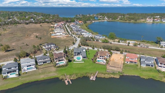 birds eye view of property with a residential view and a water view