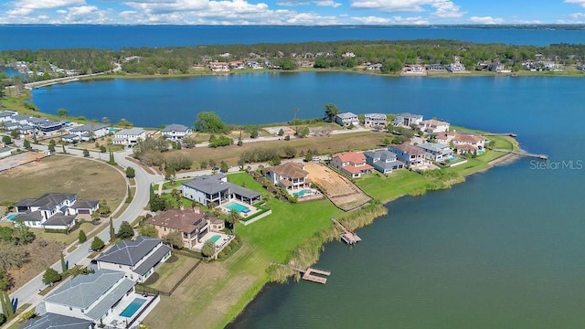 birds eye view of property featuring a residential view and a water view