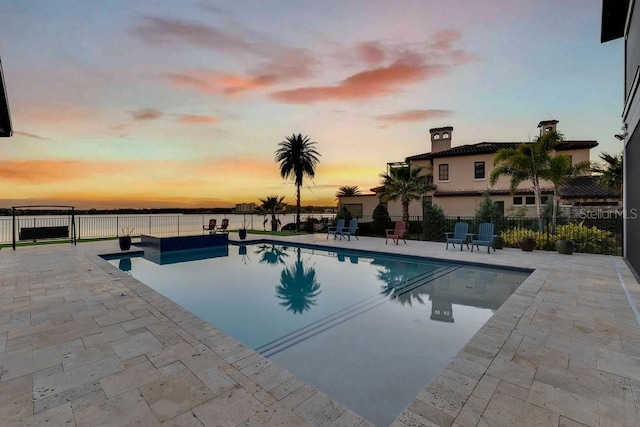 view of pool with a patio, fence, and a fenced in pool