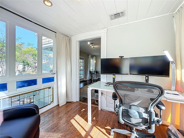 home office with visible vents, wood ceiling, and wood finished floors