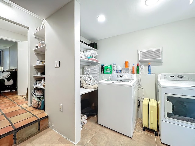 laundry room featuring washer and dryer, laundry area, and light tile patterned floors