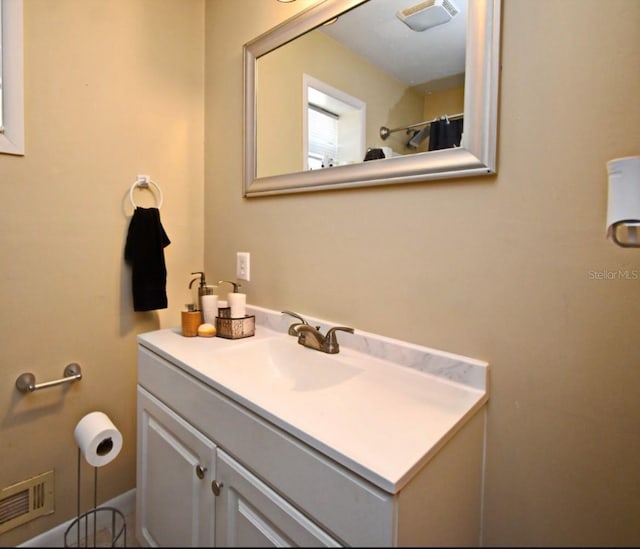 bathroom with vanity and visible vents