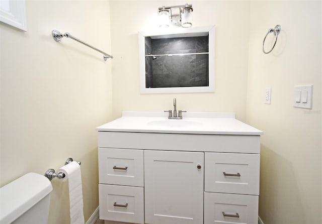 bathroom with vanity and toilet