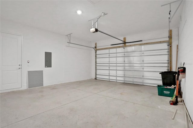 garage featuring a garage door opener and electric panel