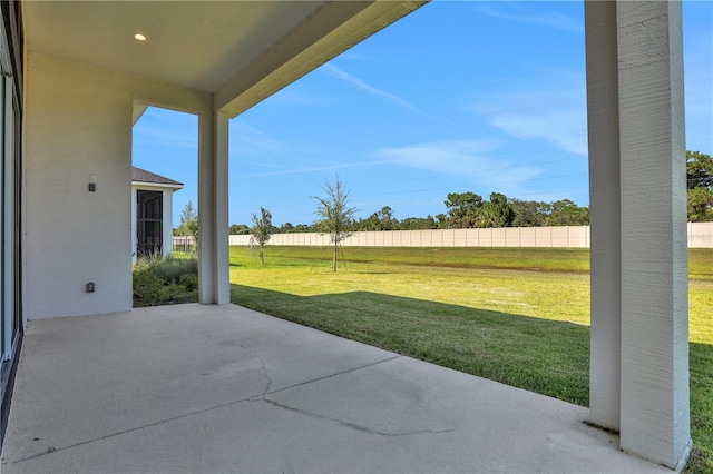 view of patio featuring fence