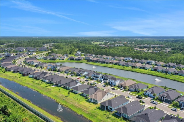 drone / aerial view with a water view and a residential view