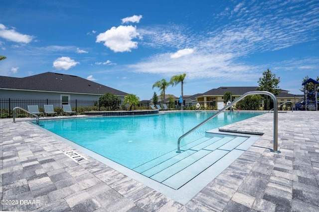 community pool featuring fence