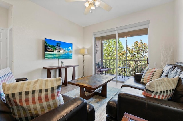 living room featuring wood finished floors and ceiling fan