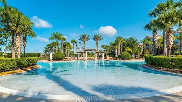 community pool with a pergola