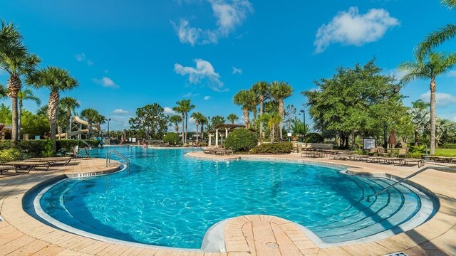 community pool with a patio area