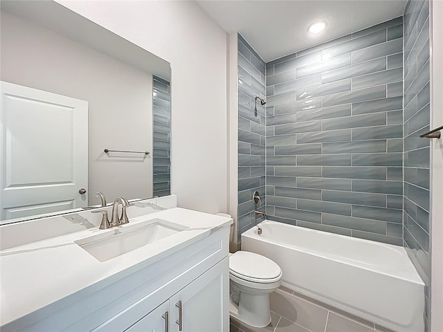 bathroom featuring tile patterned floors, vanity, toilet, and  shower combination