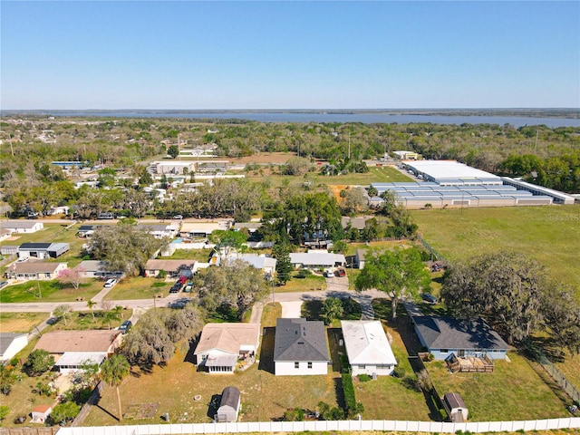 bird's eye view with a residential view and a water view