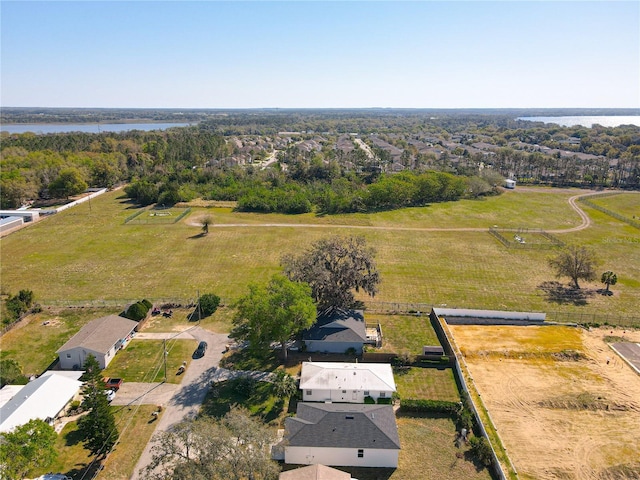 aerial view with a rural view and a water view