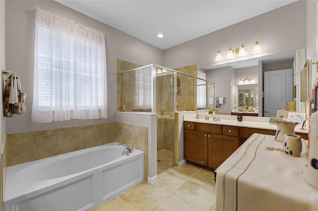 full bathroom featuring vanity, a shower stall, a bath, and tile patterned flooring