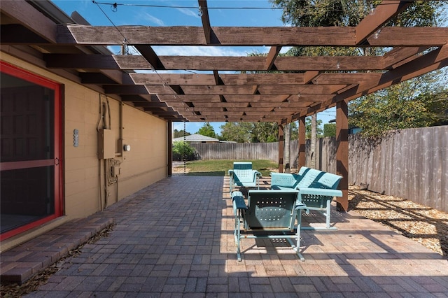 view of patio featuring a fenced backyard and a pergola