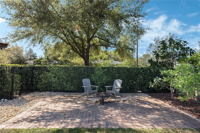 view of patio / terrace featuring a fenced backyard and a fire pit