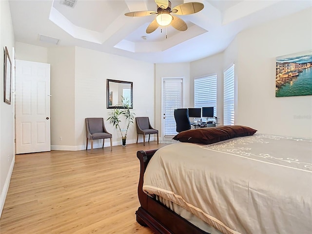 bedroom with beamed ceiling, baseboards, coffered ceiling, and light wood finished floors